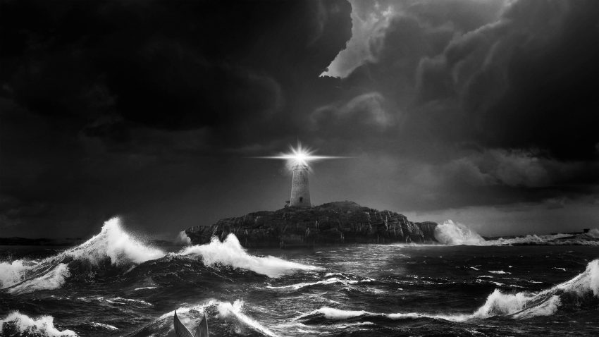 A black and white image of a lighthouse in a stormy sea.