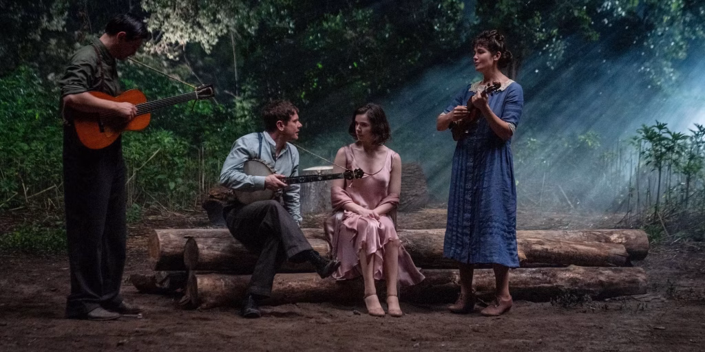 The three vampires serenade a woman in the woods.