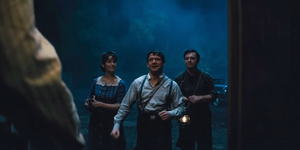Three smiling vampires approach the juke joint
