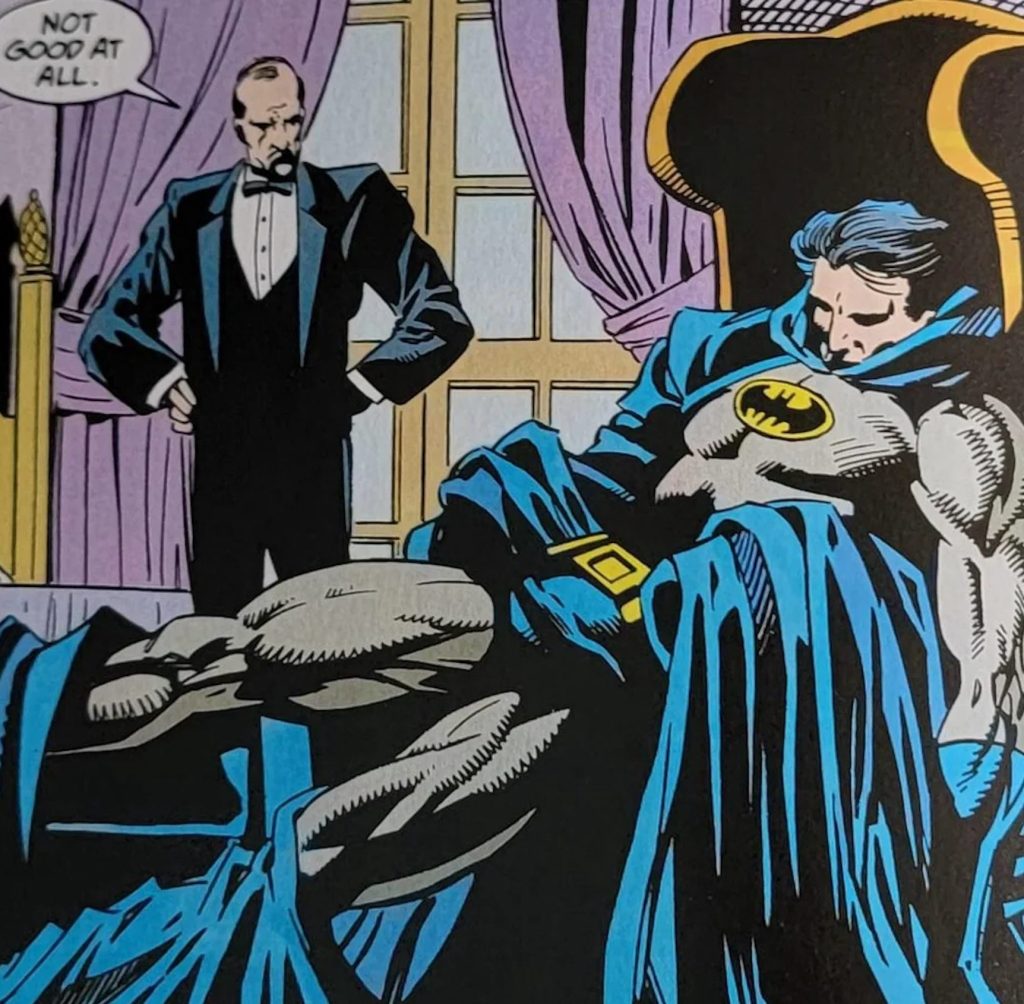 Batman collapses onto an armchair, fast asleep, while Alfred watches.